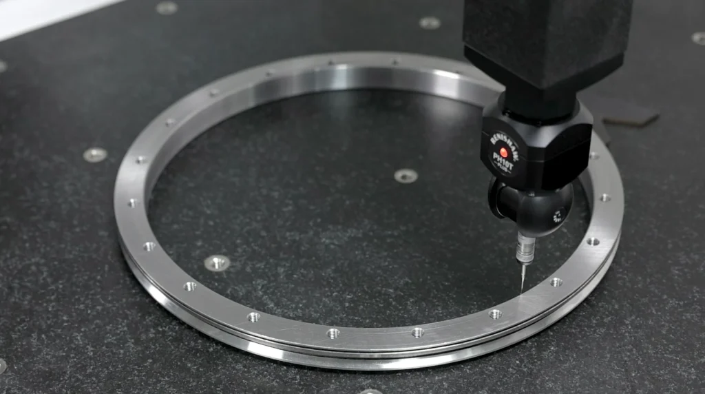 Coordinate measuring probe checking a bearing ring on a granite measuring table
